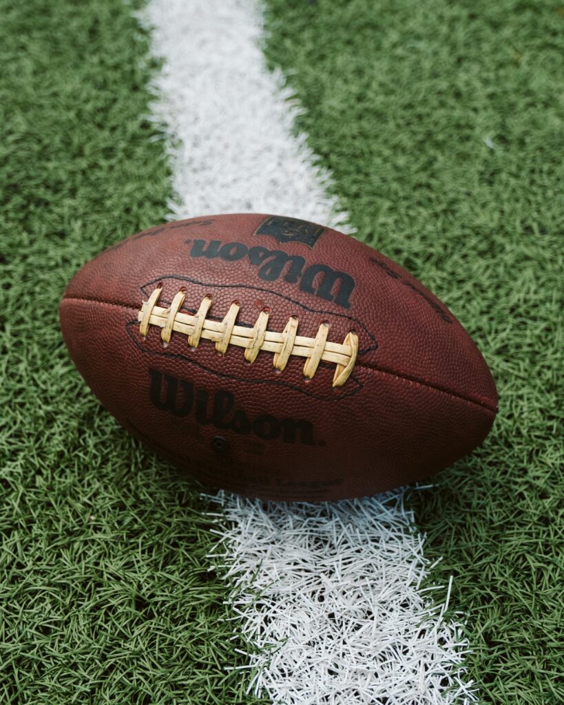 a football on the field for a college football game